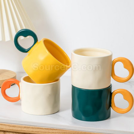 Ceramic cup with a heart - shaped handle